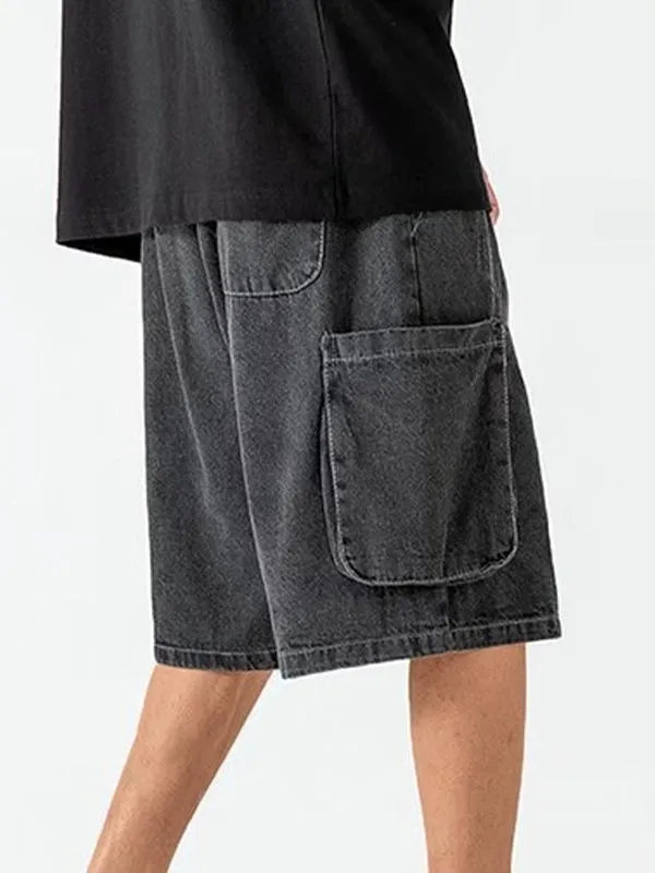 Dark grey vintage men's denim shorts with ripped pockets