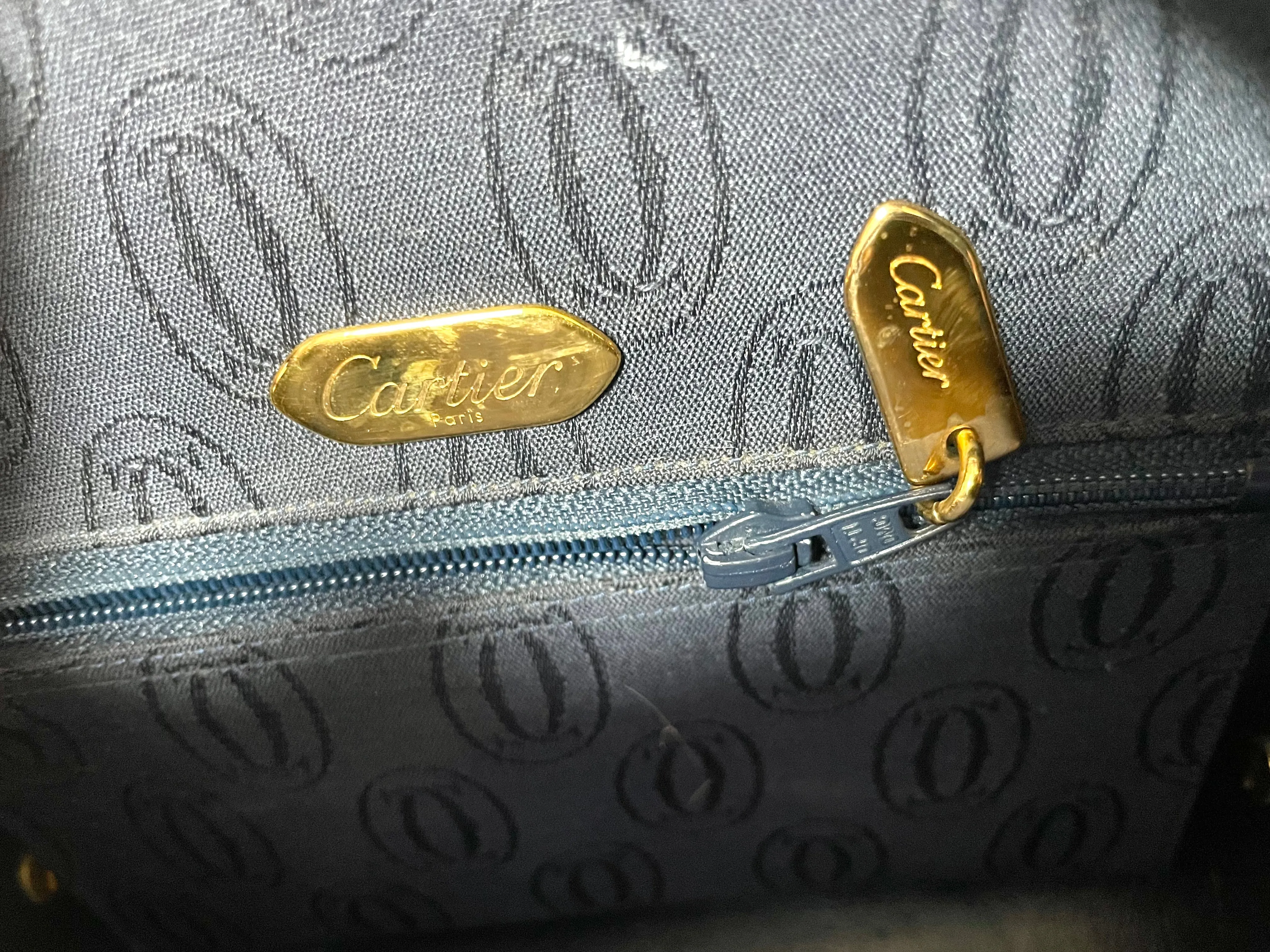 Vintage Cartier navy oval shape shoulder bag with blue stone and golden frame flap. Classic purse from Sapphire line. 050919ac1