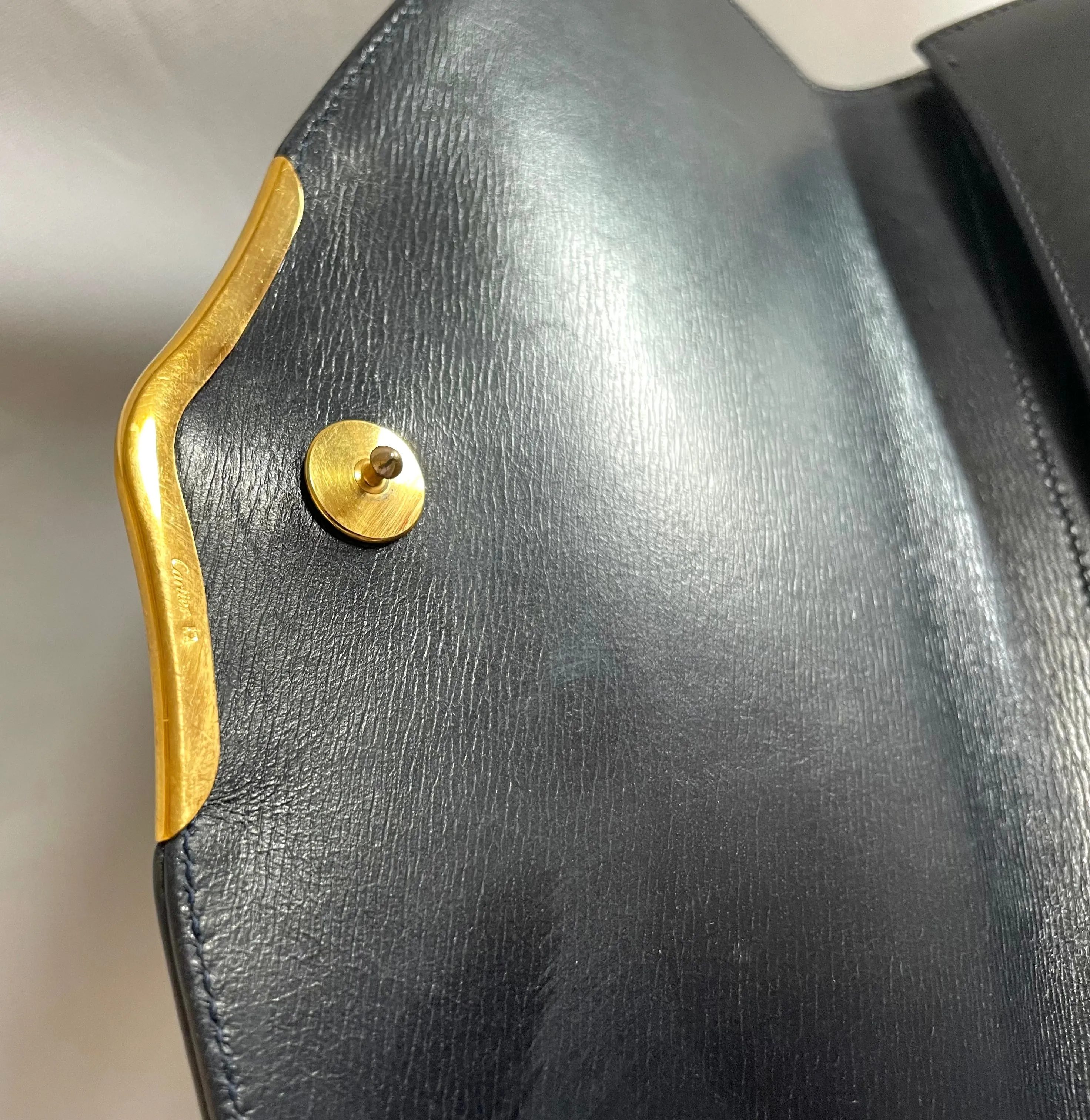 Vintage Cartier navy oval shape shoulder bag with blue stone and golden frame flap. Classic purse from Sapphire line. 050919ac1