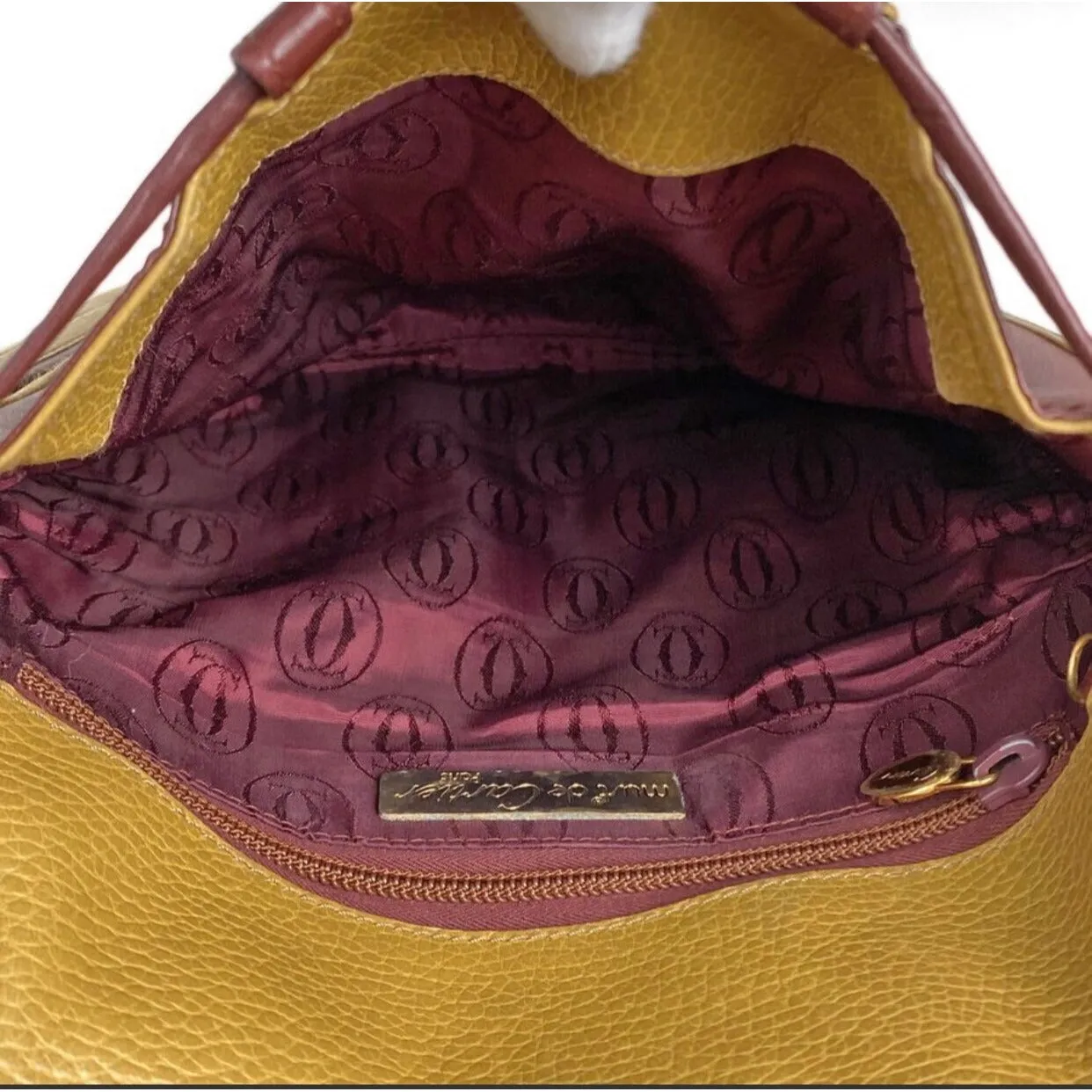 Vintage Cartier yellow mustard leather shoulder purse with gold-tone logo charm and wine leather tassel charm. Must de cartier collection